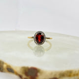 Diamantring med Rød Granat 0.30ct tw/si